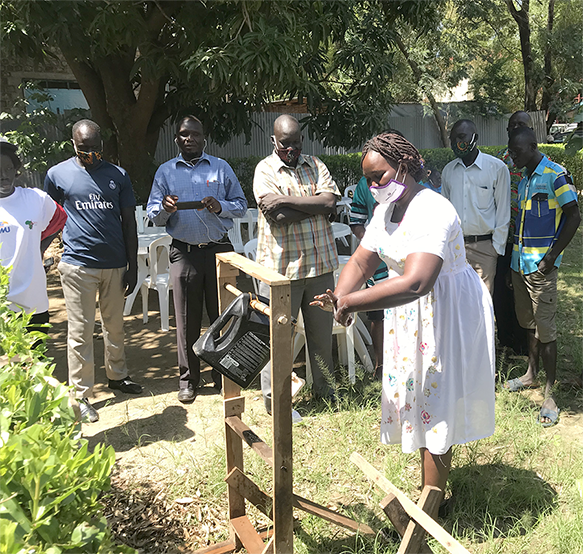 handwashing with tippy tap